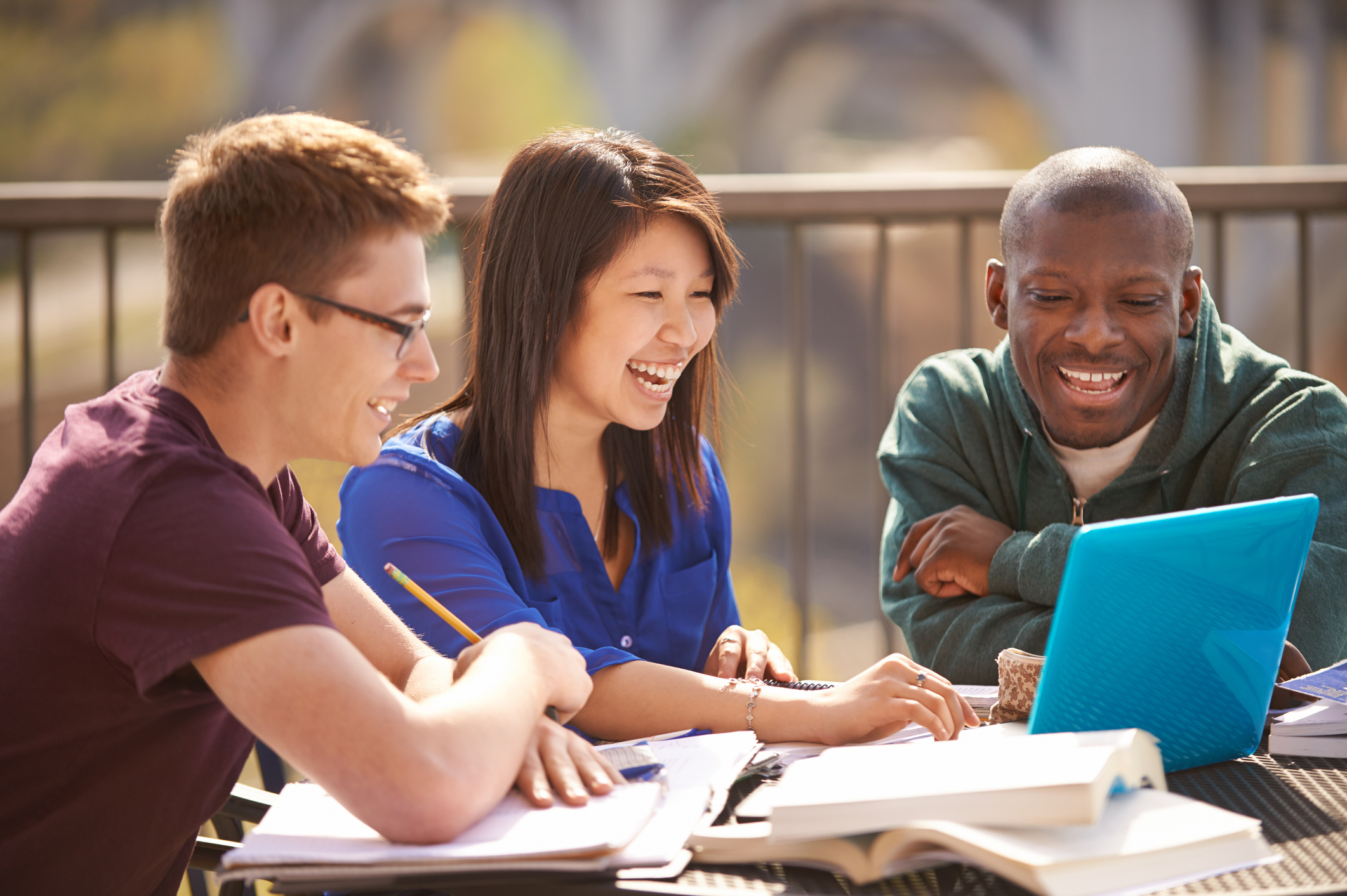 Cropped shot of students studying outside on